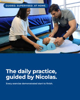 Two parents guiding their baby through an exercise on The Core at home